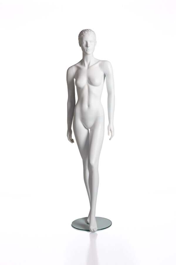 A white mannequin standing in front of a mirror.